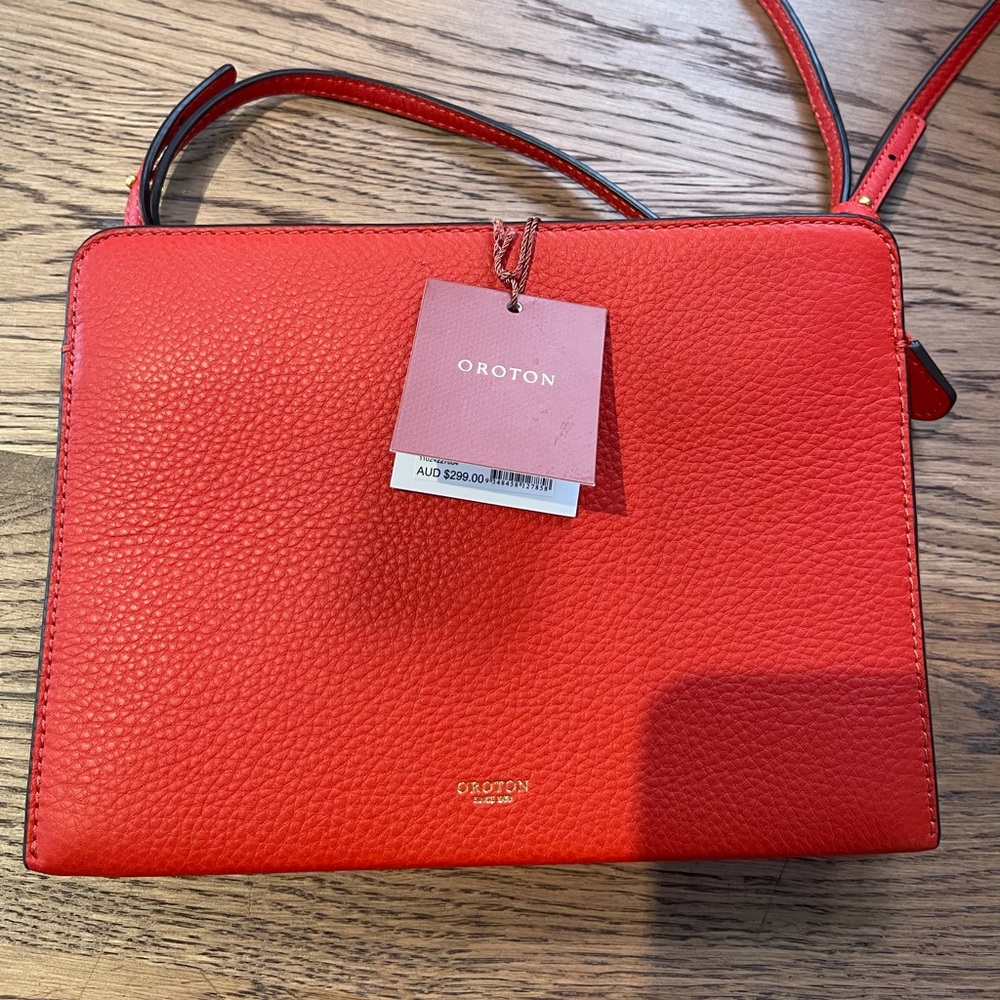 Red Oroton cross body purse.